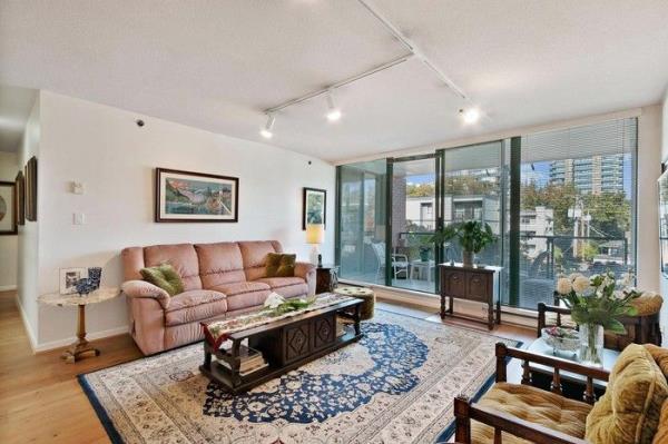 living room sofa and coffee table with view to patio