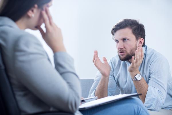 angry white man talking to doctor