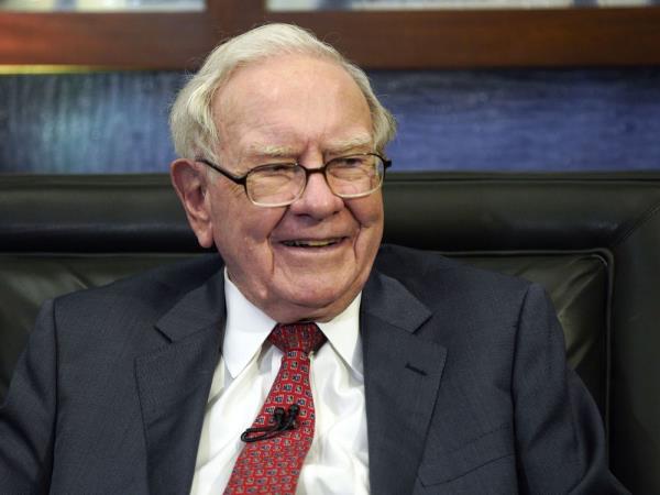 FILE - Berkshire Hathaway Chairman and CEO Warren Buffett smiles during an interview in Omaha, Neb., May 7, 2018. After 17 years of steady payments, including those announced Wednesday, June 21, 2023, Buffett has given annual do<em></em>nations totaling $50.7 billion toward his historic multibillion-dollar pledges to the Bill & Melinda Gates Foundation and to four foundations co<em></em>nnected to his family.