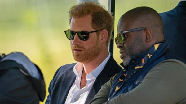 The Duke of Sussex and photographer Misan Harriman in April 2022