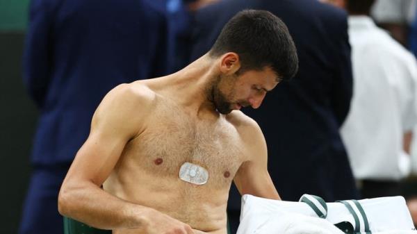 Tennis - Wimbledon - All England Lawn Tennis and Croquet Club, London, Britain - July 14, 2023 Serbia&#39;s Novak Djokovic during a break in play during his semi final match against Italy&#39;s Jannik Sinner REUTERS/Toby Melville
