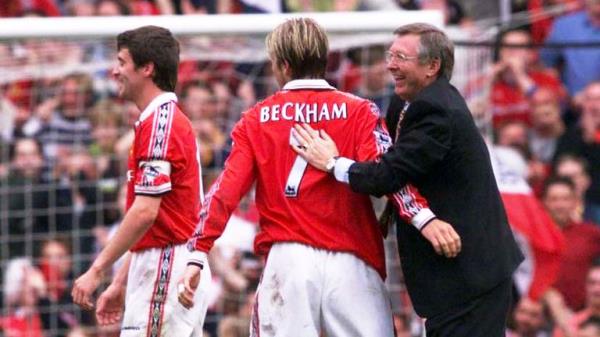 Alex Ferguson (right) co<em></em>ngratulates David Beckham (centre) and Roy Keane after his side clinched the Premiership Title at Old Trafford